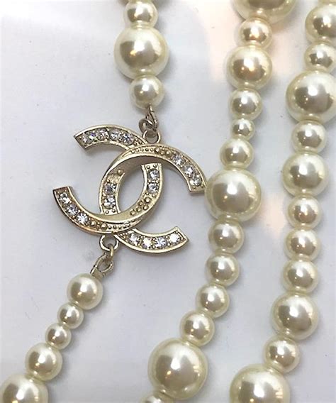 long strand of chanel pearls|Chanel long necklace.